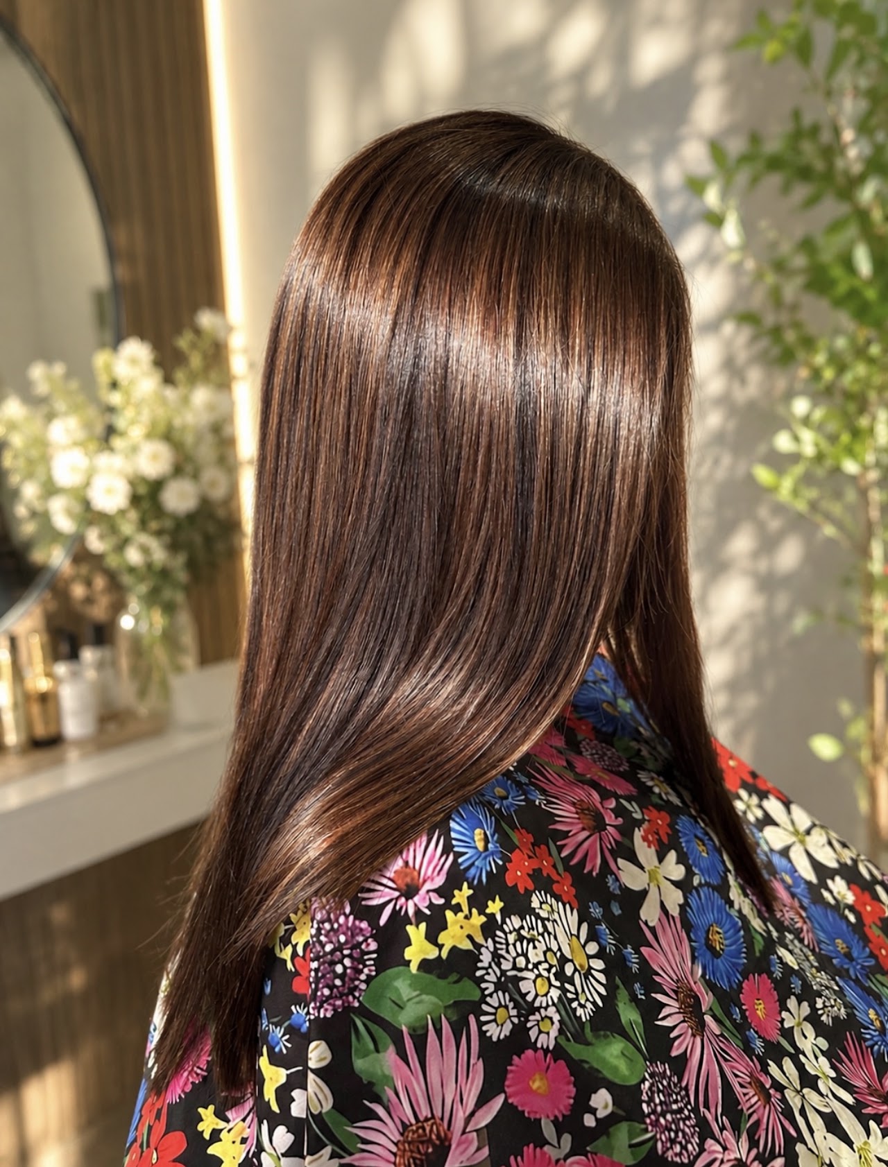 Professional hair salon result: vibrant copper color transformation with a modern cut. Sharp focus, professional lighting.